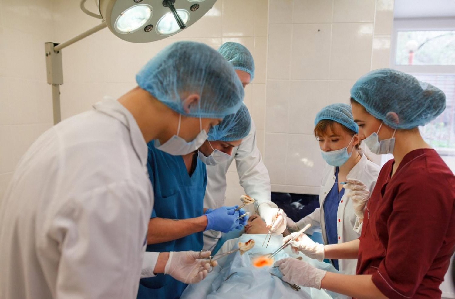 Emergency appendix removal surgery being carried out by a hospital surgical team