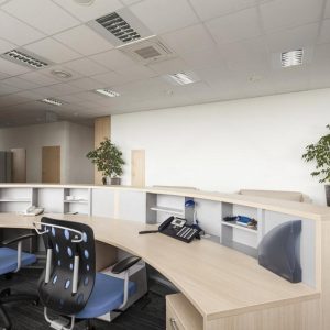 Empty UAE company reception desk with two office chairs and a business phone